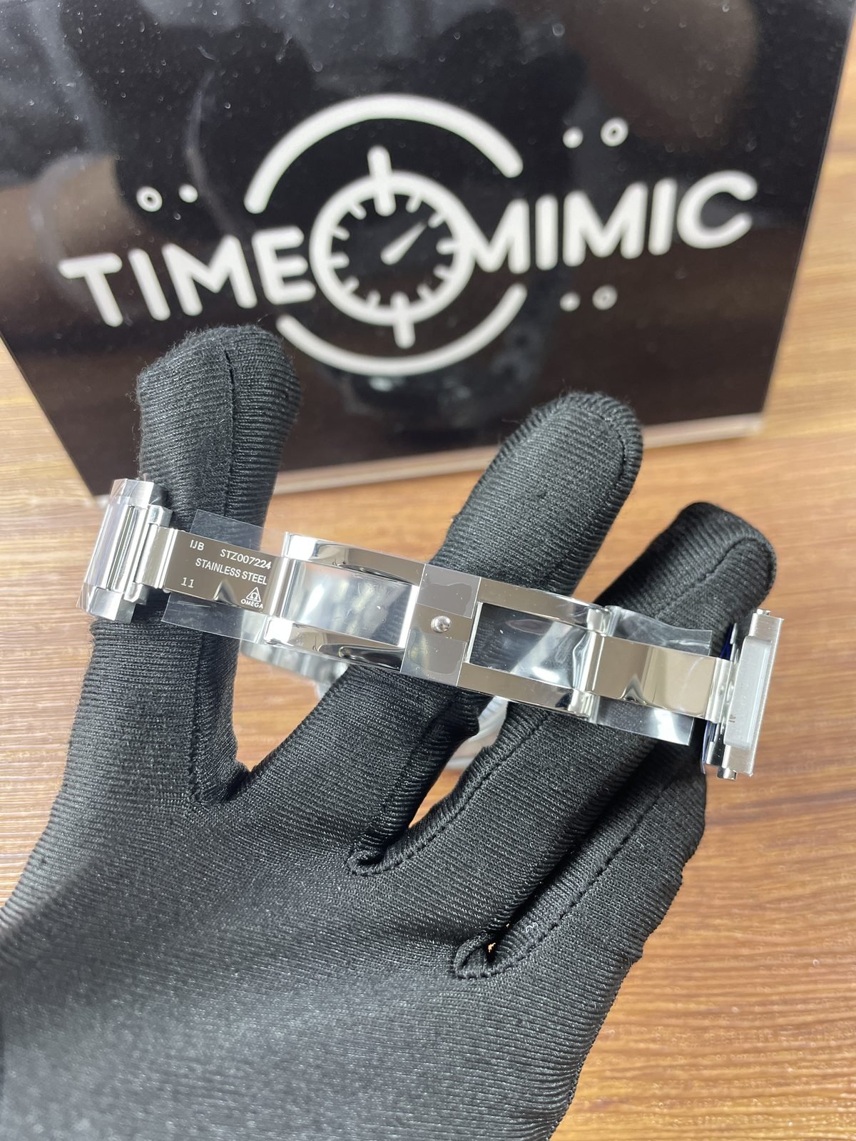 Open Worldtimer replica clasp interior with UB STZ007224 stainless steel 11 and Omega style marks