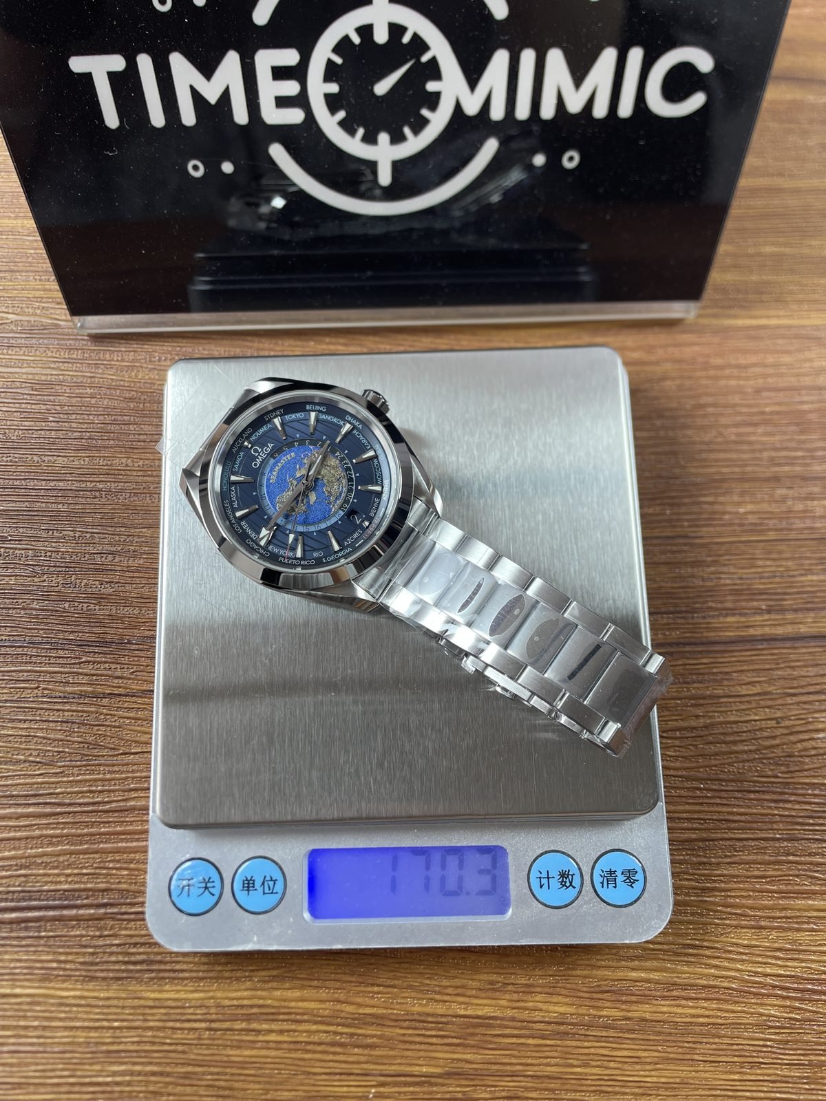 Blue Aqua Terra Worldtimer replica on digital scale displaying about 178.3 grams