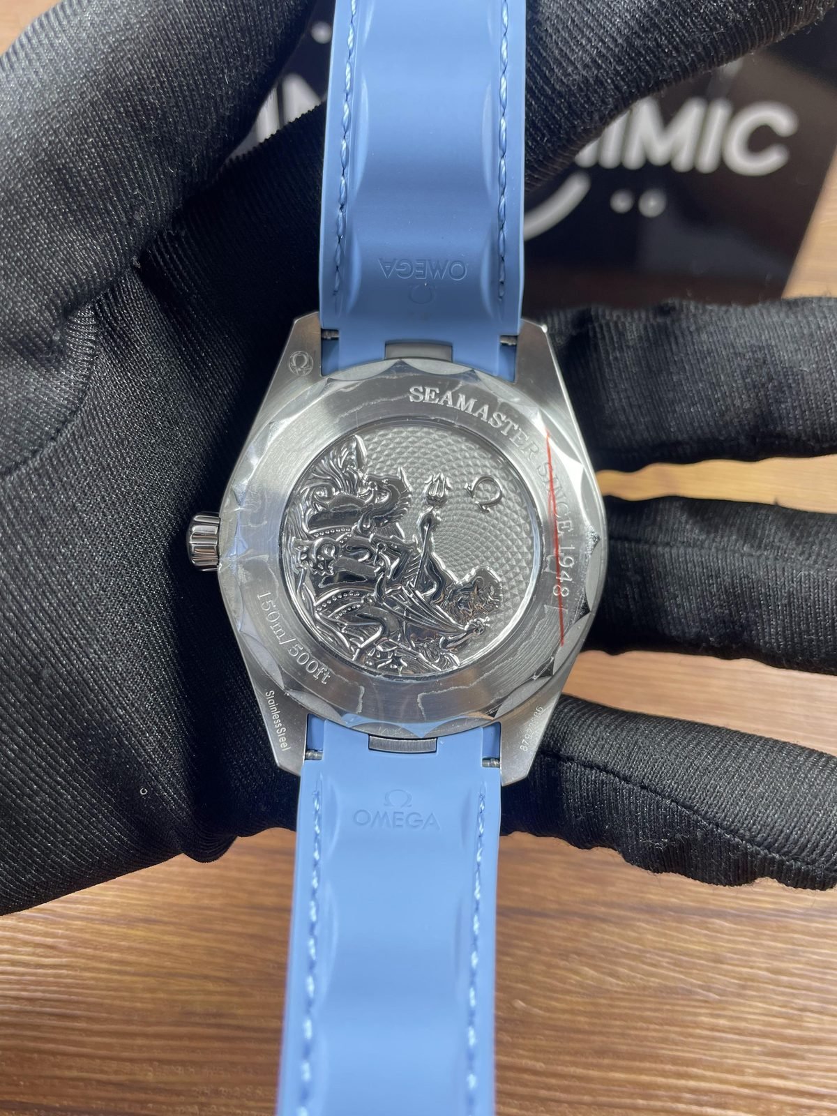 Solid sculpted Seamaster style caseback of Summer Blue Worldtimer replica with Poseidon seahorse depth and code style marks