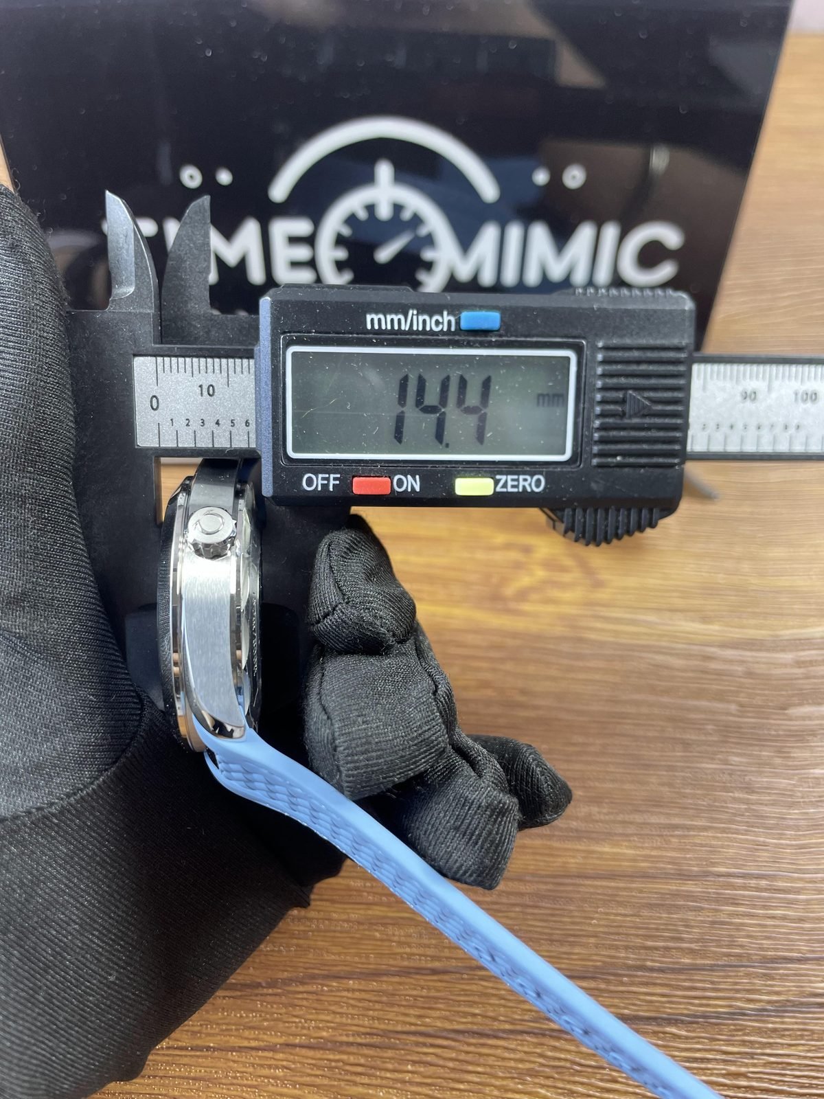 Digital calliper displaying about 14.4 millimetres across a thickness style placement on Summer Blue Worldtimer replica