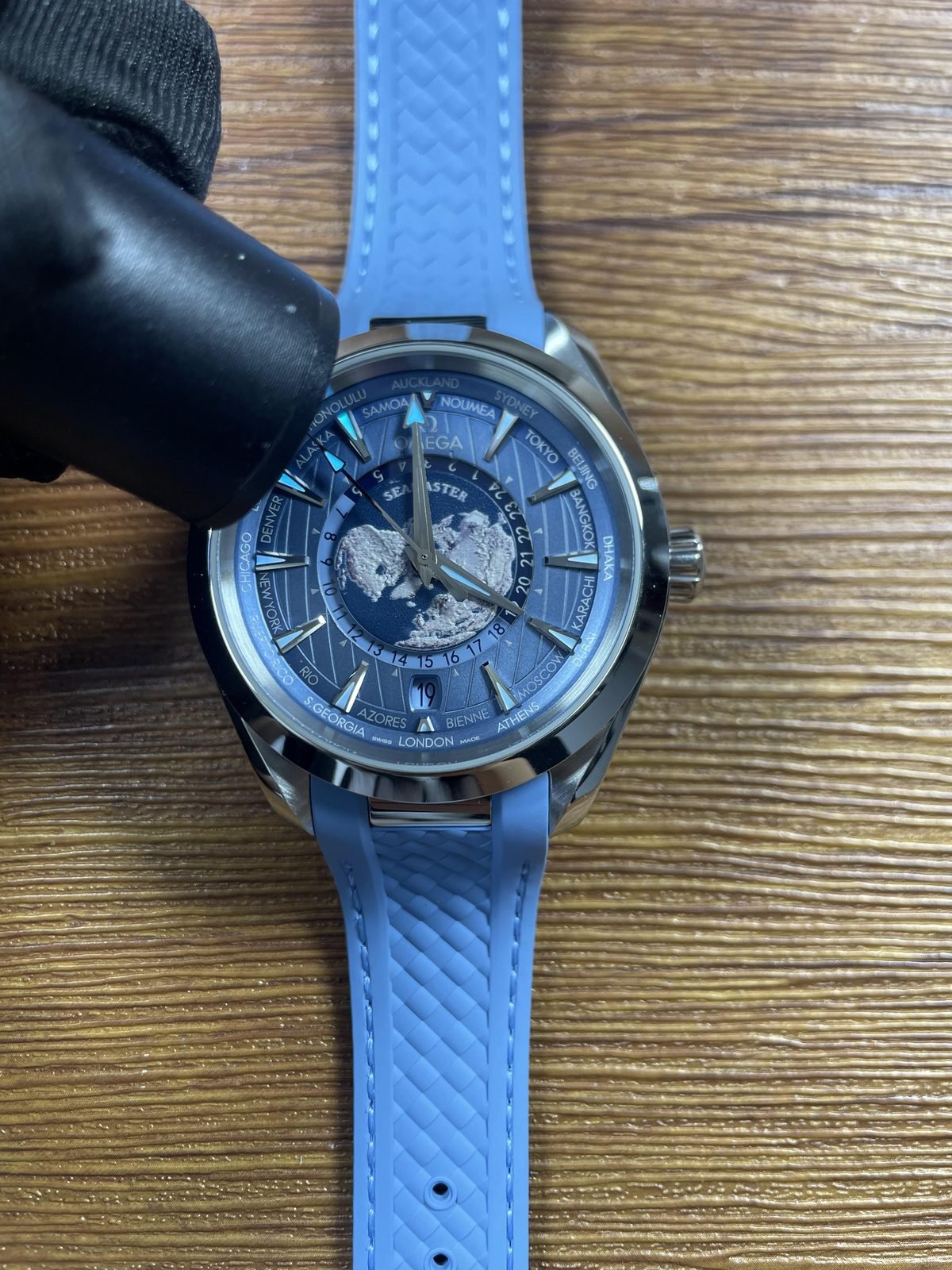 Summer Blue Worldtimer replica showing immediate blue cyan luminous style response on hands and indexes
