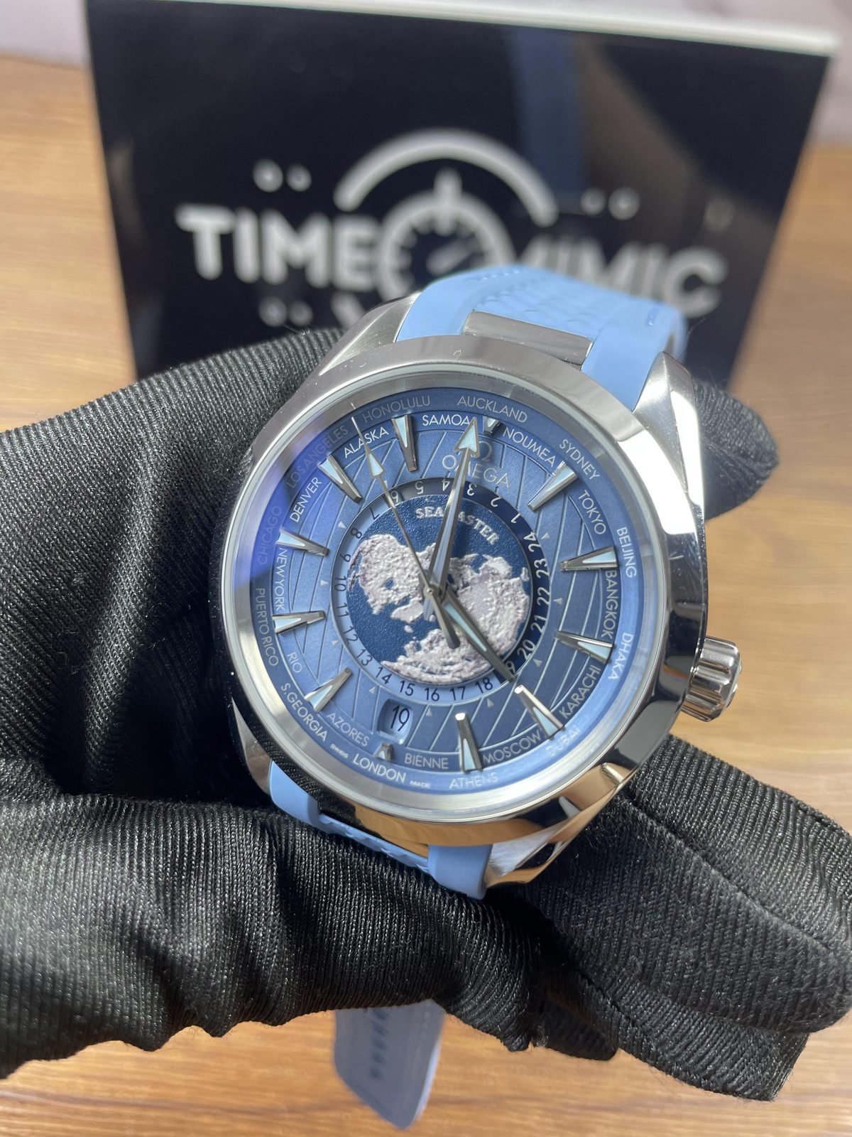 Oblique close view of Summer Blue Worldtimer replica dial map cities 24 hour ring date and case