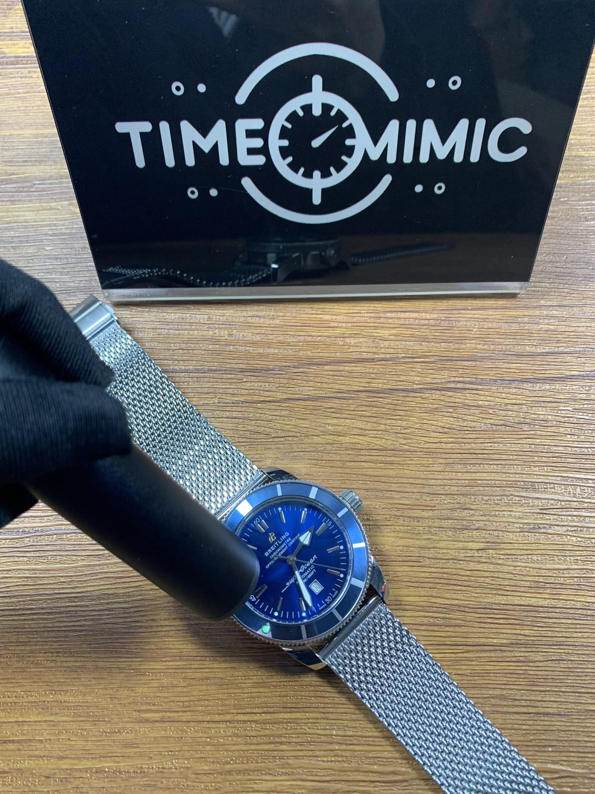 Breitling Superocean custom replica cyan blue hand and marker response under directed light