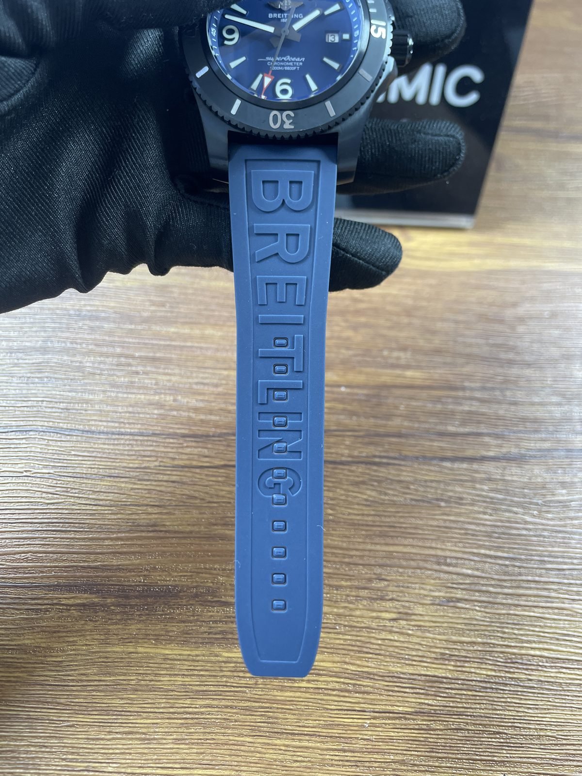Breitling Superocean M17368D71C1S2 replica blue rubber strap holes and Breitling lettering