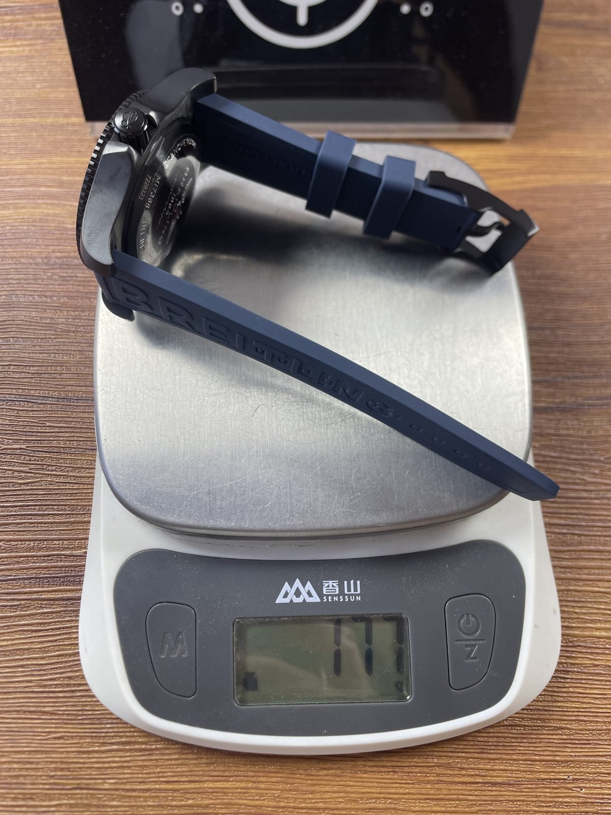 Breitling Superocean M17368D71C1S2 replica pictured scale reading about 111 grams