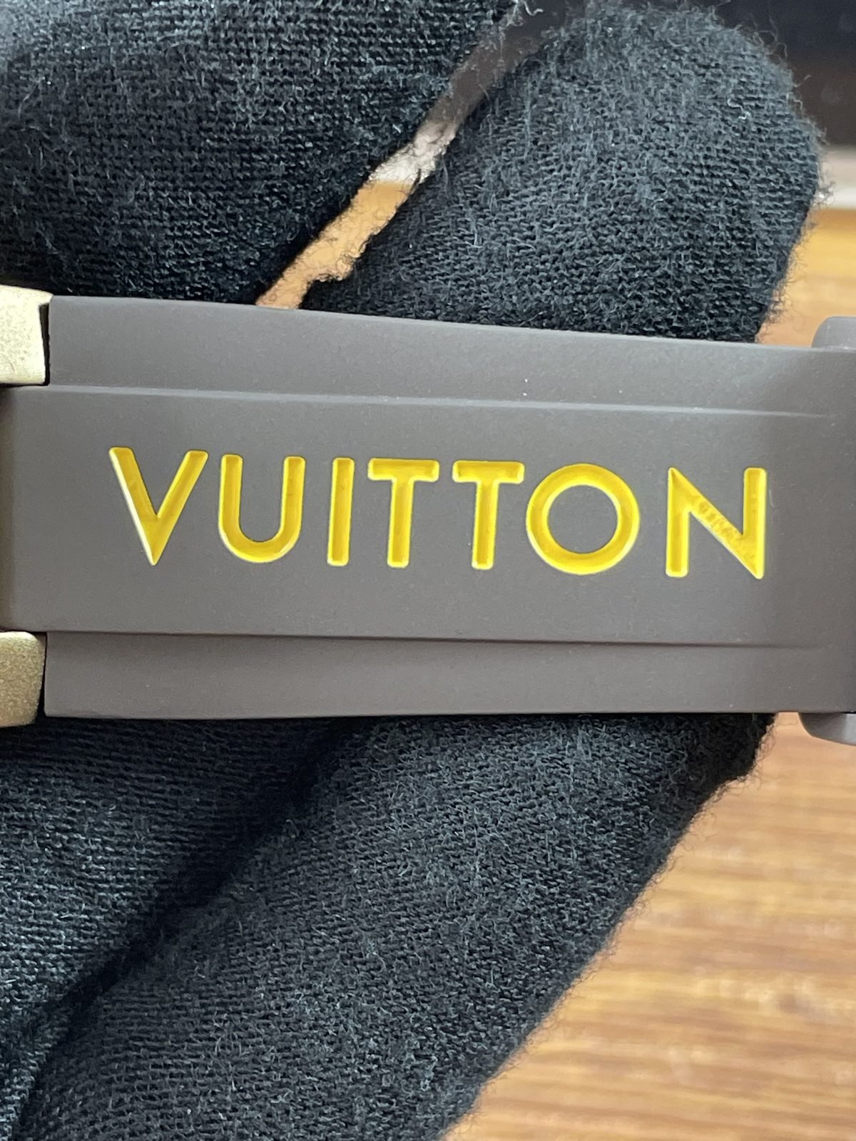 Louis Vuitton Tambour Horizon N1 replica grey brown strap raised yellow VUITTON letters close view